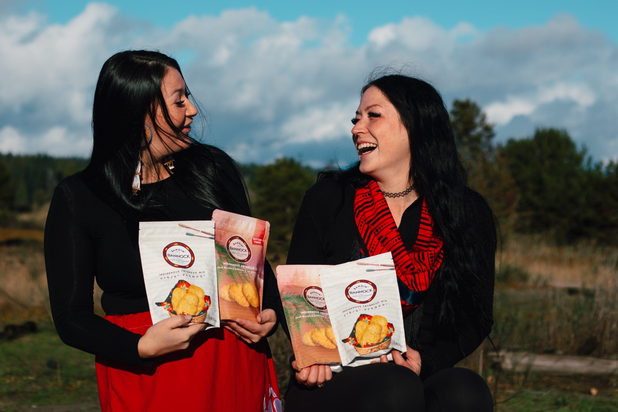 Bangin' Bannock owners Destiny Houshte and Kelsey Coutts holding bannock mix bags